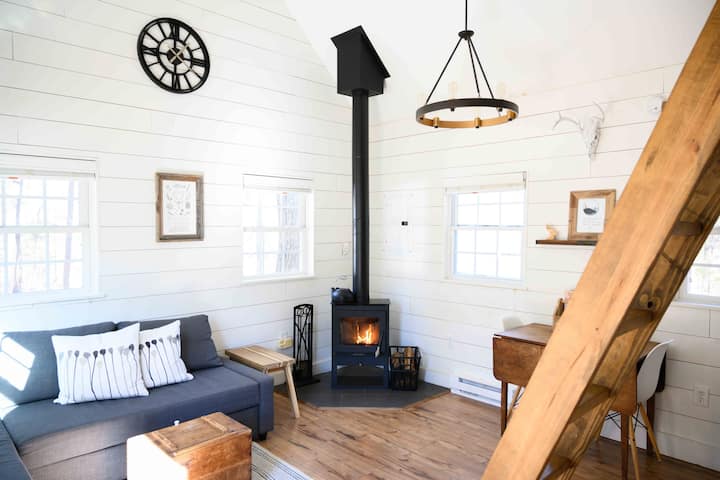 The wood stove is perfect for those cold days and nights. Couch converts into a double bed. 