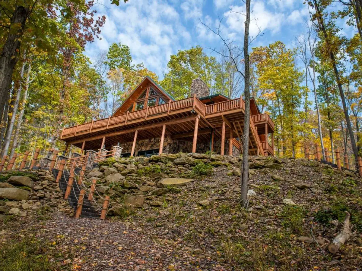 two floor log cabin on hill